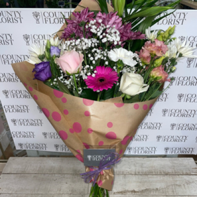 Flowers wrapped in paper  - Pinks, whites , purples wrapped and tied in paper 