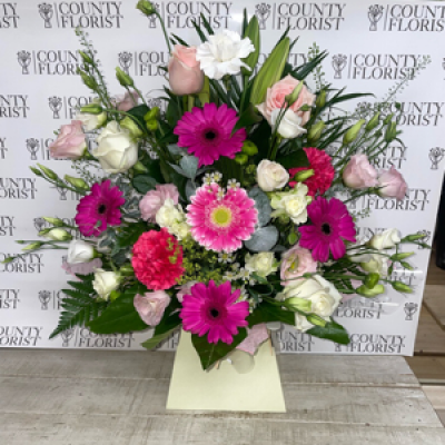 Front facing  - A front facing arrangement in oasis In pinks and whites 