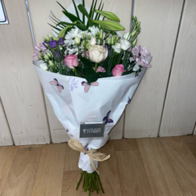 Pretty wrap of flowers  - A pretty selection of florist choice wrapped flowers in pretty paper - perfect for mum to put in a vase herself ! Please specify if you would like any particular colours or flowers 