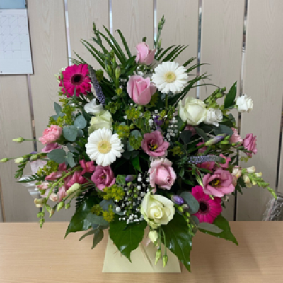 Front facing arrangement  - A front facing arrangement , In mainly pinks whites and greens - please specify if you’d like different colours 