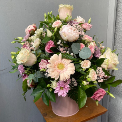 Pot of Happiness - A small but choice selection of flowers arranged in a petite container. Perfect for that token gift.