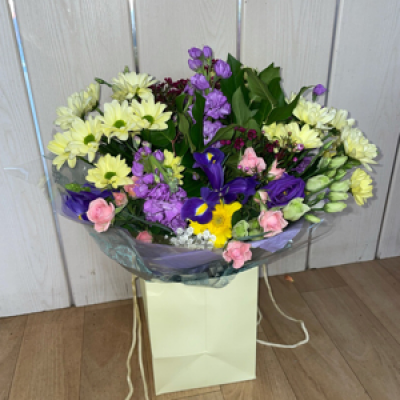 Bag arrangement in spring colours  - This bag will include spring colours and spring flowers if available , some flowers may be substituted 