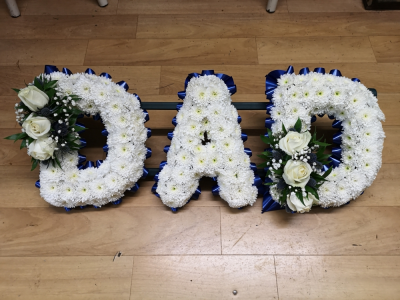 Funeral Tribute Letters - County Florist produce funeral tribute letters at £45 each and they can be done based or close or loose style with various colours of ribbon or no ribbon at all around the edge ,always speak to our florist when ordering funeral tributes
